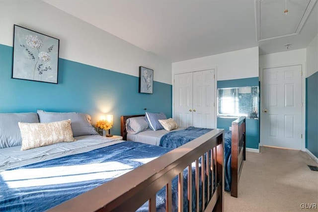 carpeted bedroom with a closet