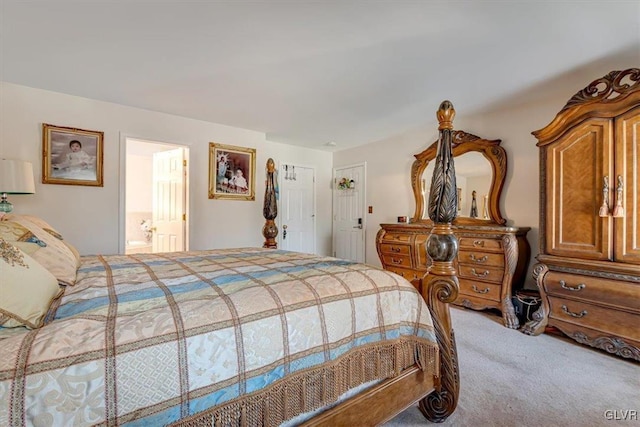 bedroom featuring carpet and connected bathroom