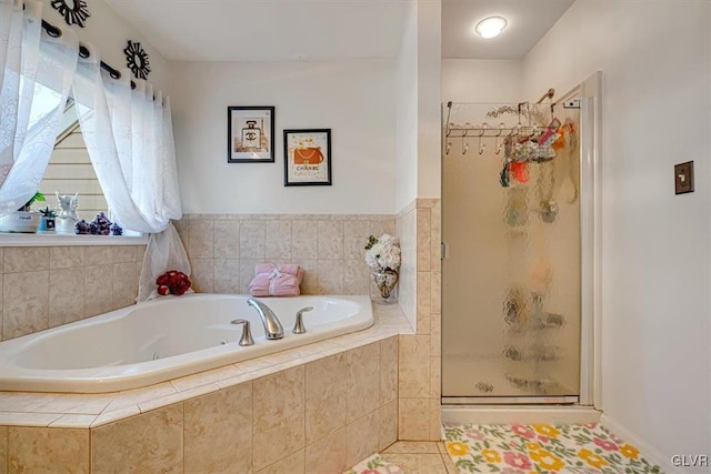 bathroom with plus walk in shower and tile patterned flooring