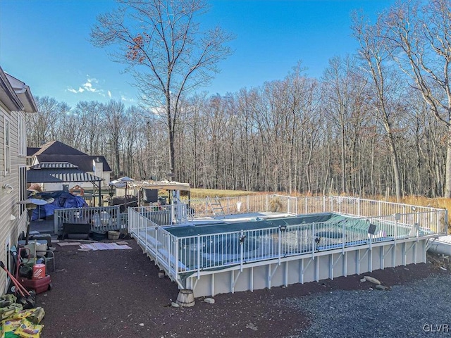 view of pool with a wooden deck