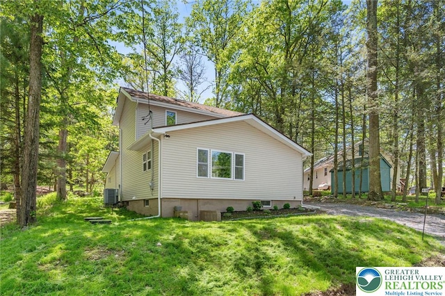 410 Sunset Forest Dr, Pike, PA 18428 - view of property exterior with a lawn and central AC unit