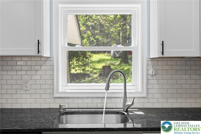 410 Sunset Forest Dr, Pike, PA 18428 - kitchen with a sink, white cabinetry, decorative backsplash, and dark stone countertops