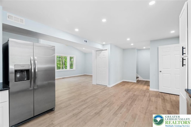 410 Sunset Forest Dr, Pike, PA 18428 - kitchen featuring stainless steel fridge with ice dispenser, open floor plan, white cabinets, light wood finished floors, and recessed lighting