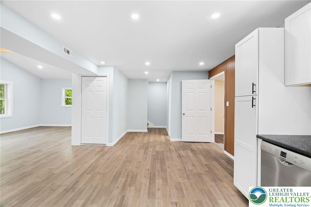410 Sunset Forest Dr, Pike, PA 18428 - kitchen with stainless steel dishwasher, white cabinets, light wood finished floors, open floor plan, and baseboards