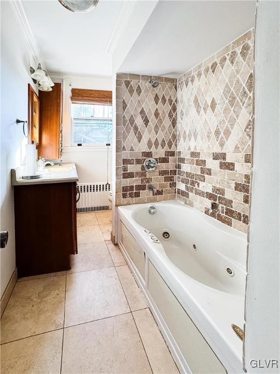 bathroom with crown molding, radiator heating unit, vanity, and tile patterned flooring