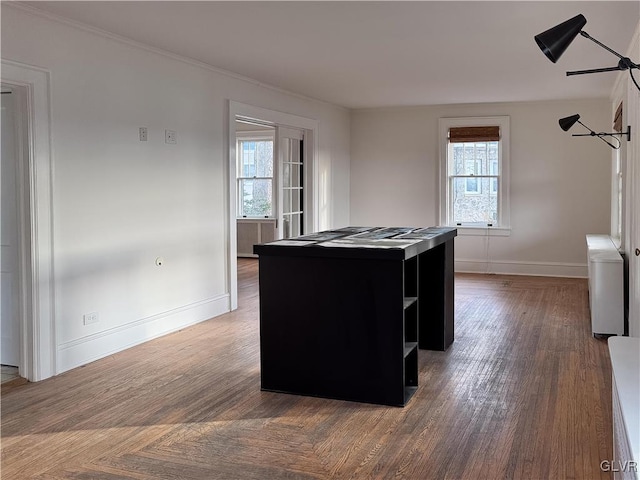 kitchen featuring a center island and dark wood-type flooring