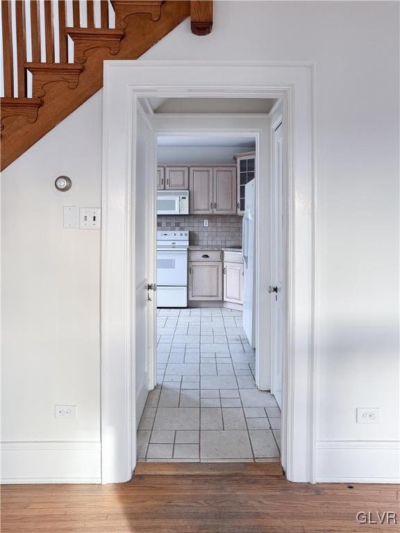 hallway with light wood-type flooring