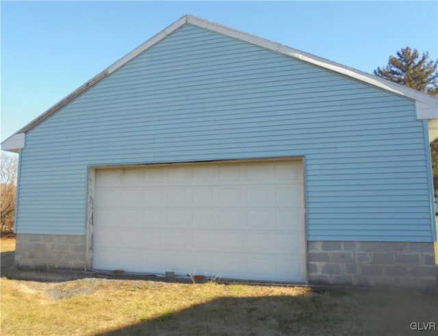 view of property exterior featuring a garage and an outdoor structure