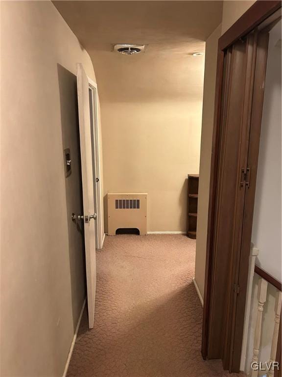 hallway with carpet flooring