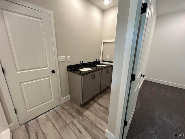 bathroom with vanity and wood-type flooring