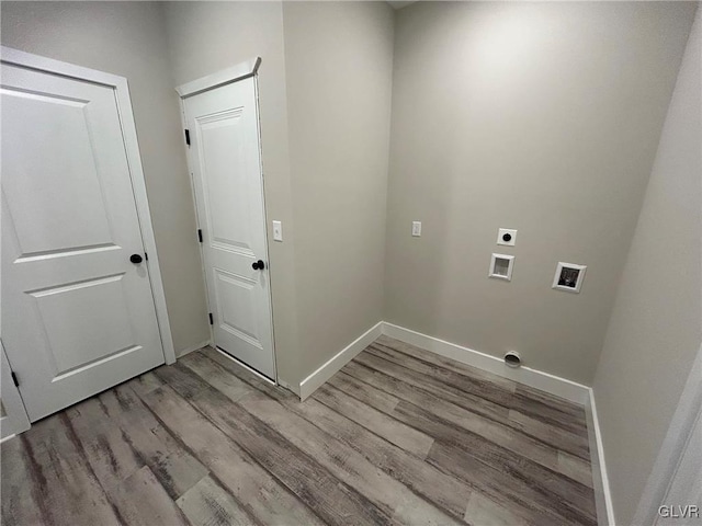 laundry area featuring hookup for a washing machine, hookup for an electric dryer, and light hardwood / wood-style flooring