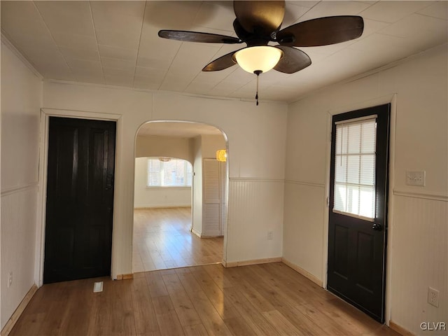 empty room featuring ceiling fan and light wood-type flooring