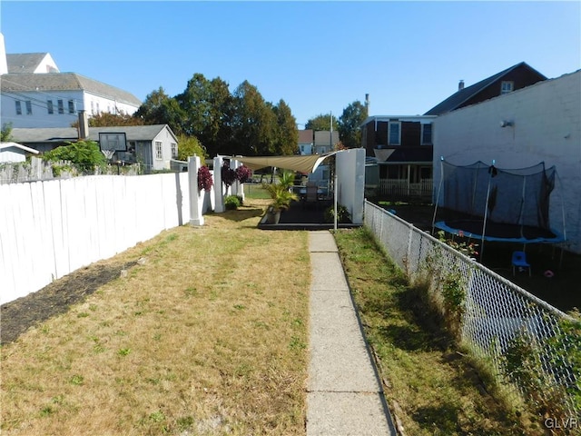 view of yard featuring a trampoline