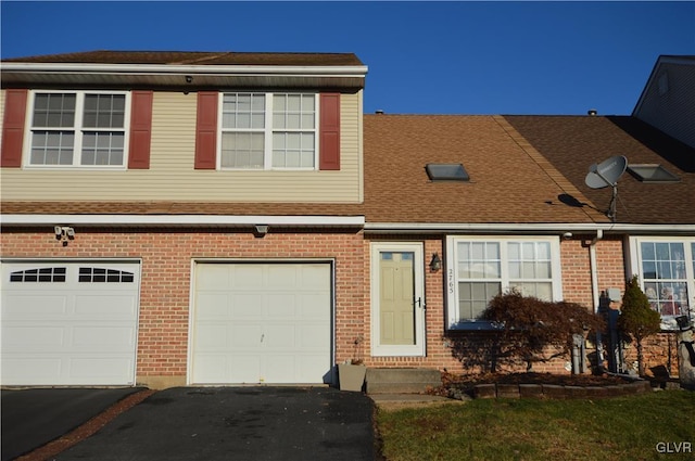 townhome / multi-family property featuring a garage