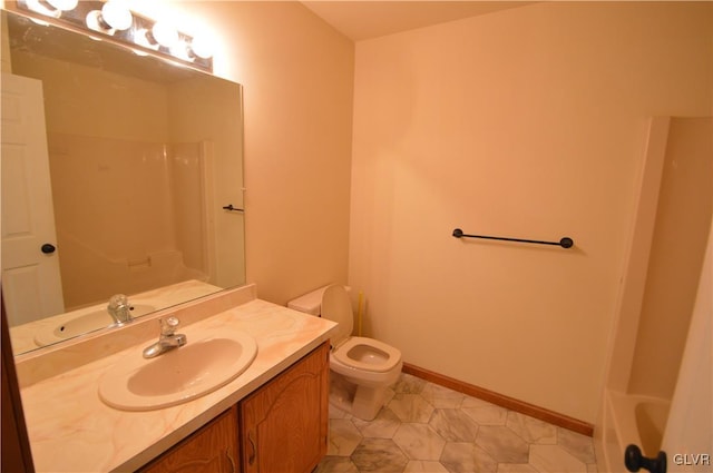 bathroom with tile patterned floors, vanity, and toilet