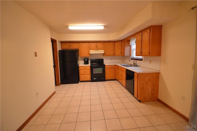 kitchen with black appliances, light tile patterned floors, and sink