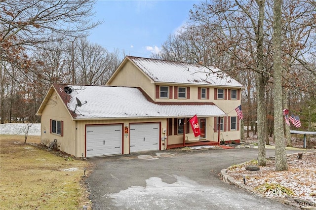 view of front of property featuring a garage and covered porch