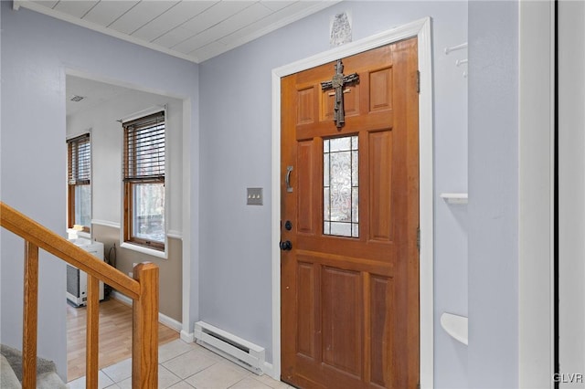 tiled foyer entrance featuring a baseboard heating unit