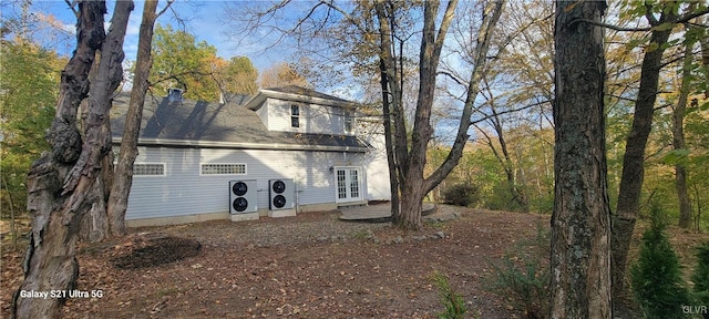 rear view of property featuring french doors