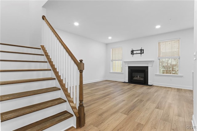 unfurnished living room with light hardwood / wood-style floors