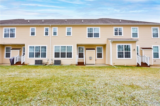 back of property featuring central AC unit