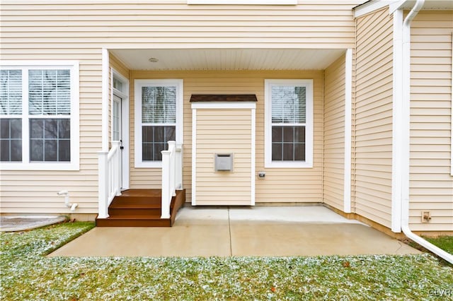 entrance to property with a patio