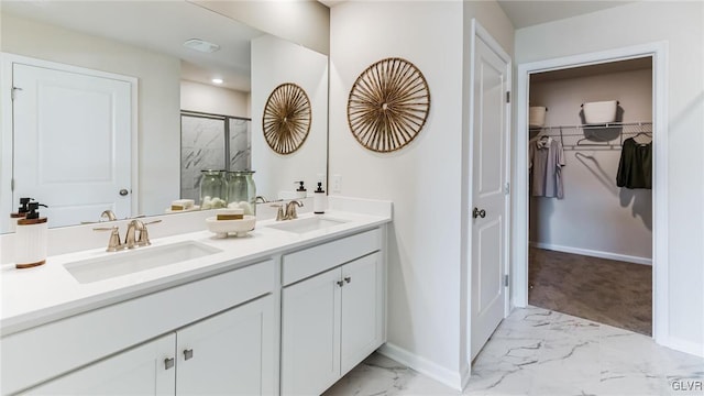 bathroom featuring vanity and an enclosed shower