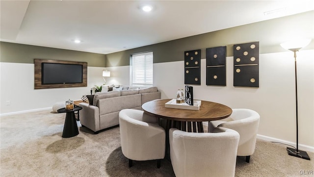 dining room featuring light colored carpet