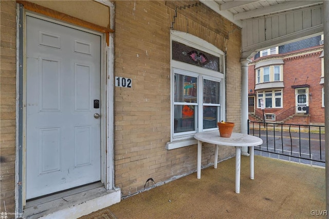 property entrance with covered porch