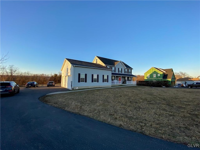 view of front facade with a front yard and a garage