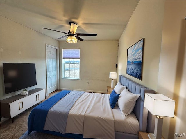 carpeted bedroom with a closet and ceiling fan