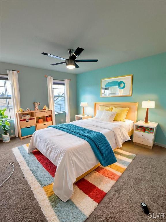 carpeted bedroom featuring ceiling fan