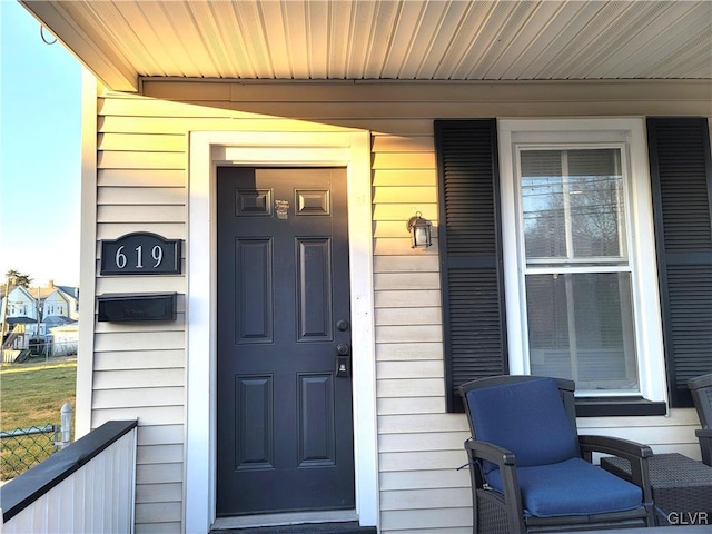 entrance to property featuring a porch