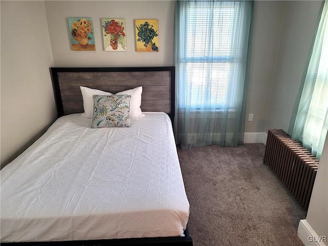 bedroom with carpet and radiator