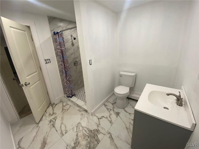 bathroom with curtained shower, vanity, and toilet