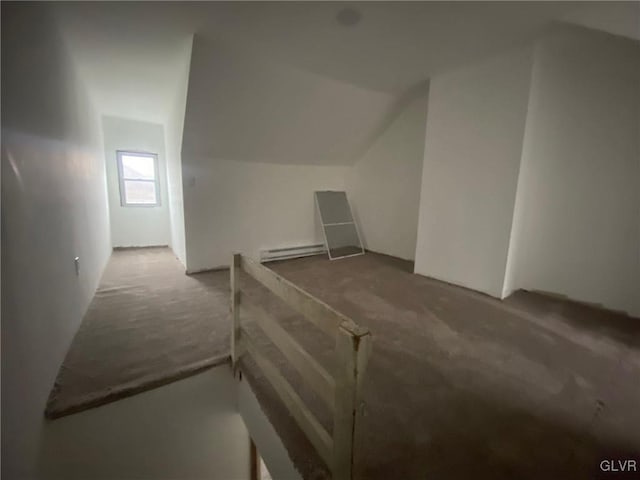 bonus room with carpet flooring, lofted ceiling, and baseboard heating