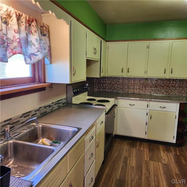 kitchen with white range with electric stovetop, sink, white cabinets, and dark hardwood / wood-style floors