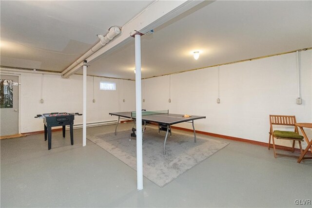 game room with finished concrete floors and baseboards