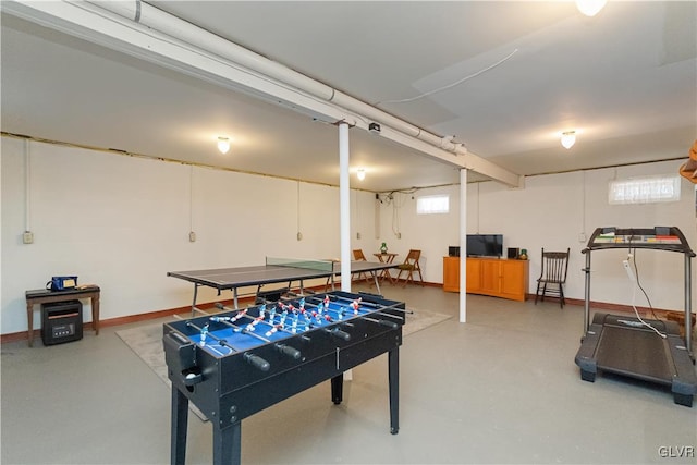 game room with plenty of natural light and concrete flooring