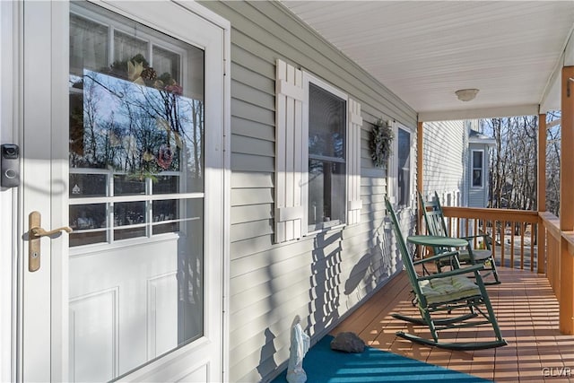 wooden terrace with a porch