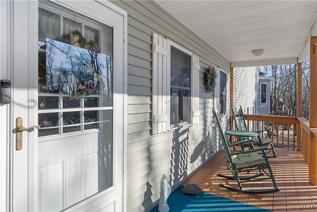 wooden deck featuring covered porch