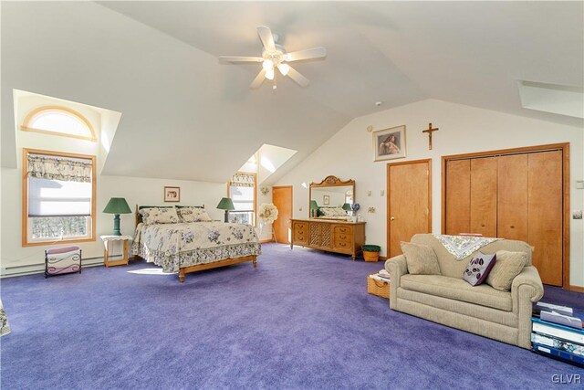 bedroom featuring lofted ceiling, carpet flooring, ceiling fan, and multiple closets