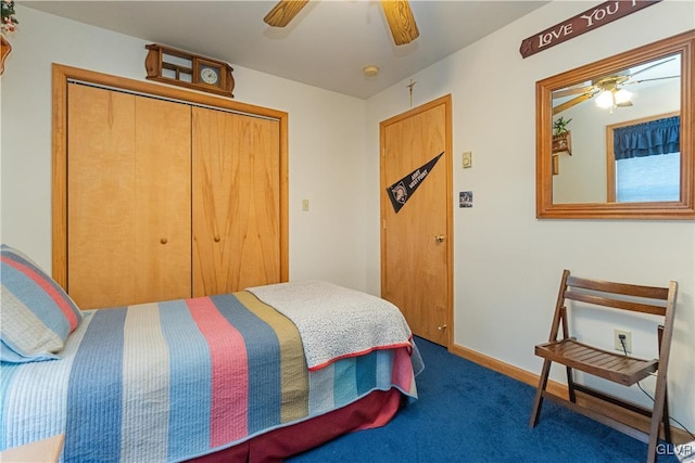 bedroom with dark colored carpet, ceiling fan, and a closet