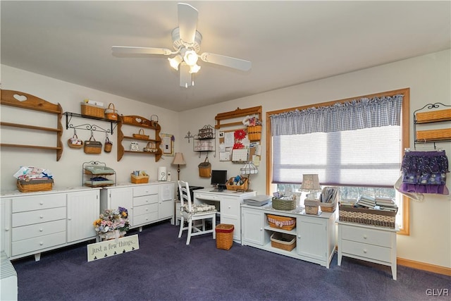 carpeted office featuring ceiling fan