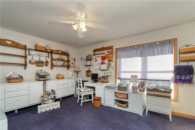 office area featuring dark carpet and a ceiling fan