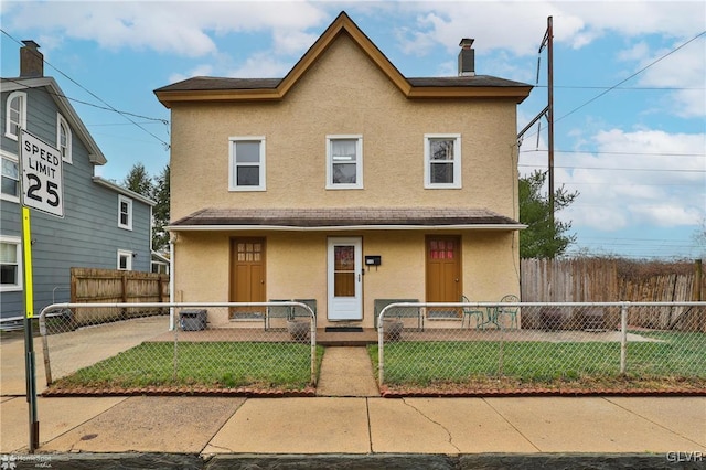 view of front of home featuring a front lawn and a porch