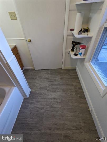 bathroom with hardwood / wood-style flooring