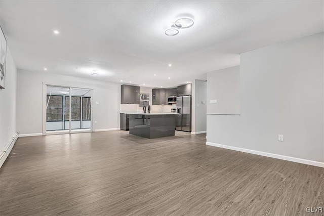 unfurnished living room with hardwood / wood-style flooring