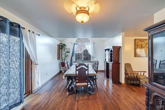 dining area with dark wood-type flooring