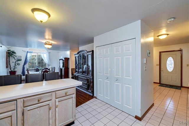 kitchen featuring light brown cabinets and light tile patterned flooring